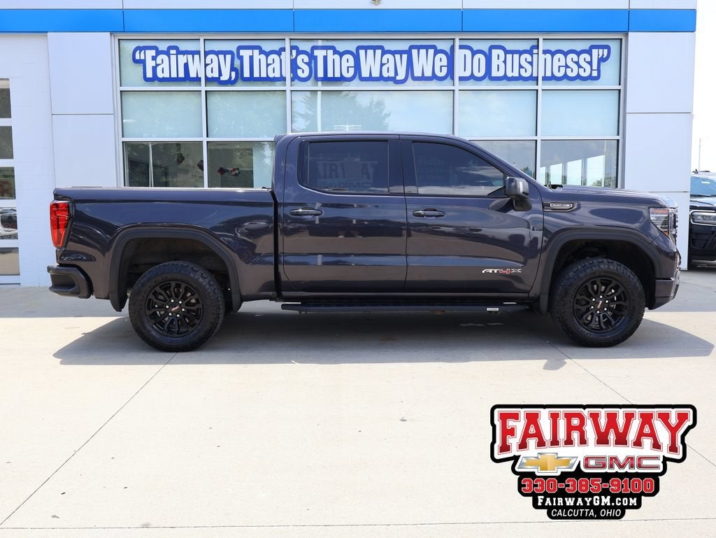 2022 GMC Sierra 1500 AT4X in Titanium Rush Metallic — front three-quarter view